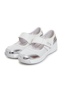 White shoes with a mesh upper, metallic silver accents, a rounded toe, and a hook-and-loop strap. Flat rubber sole with a slight lift.