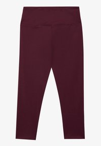 Bordowe legginsy wykonane z gładkiego, elastycznego materiału z wysokim stanem, bezszwowymi szwami i dopasowanym krojem na całej powierzchni.