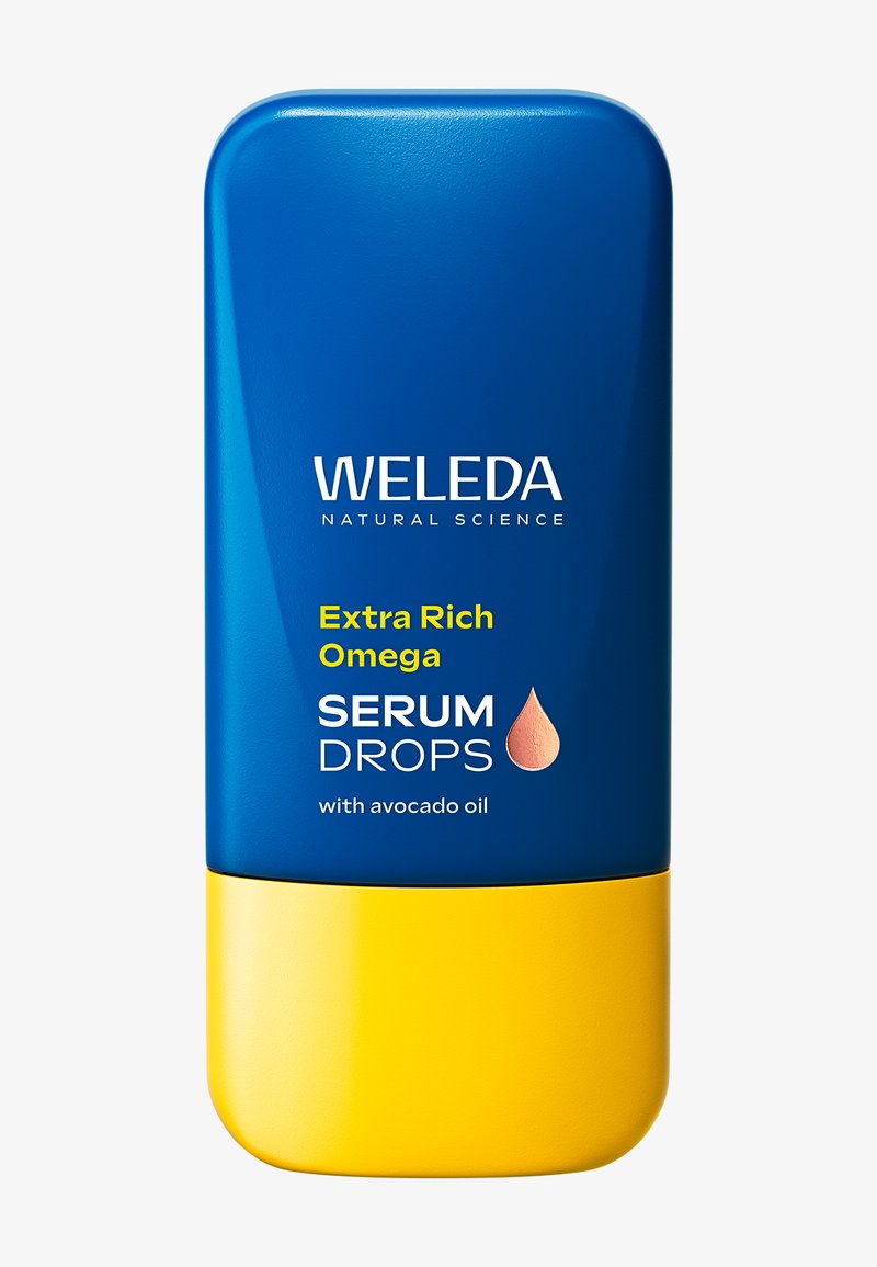 Flacone di Weleda Extra Rich Omega Serum Drops in blu e giallo con testo di olio di avocado e icona di goccia sul fronte.