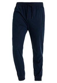 Navy jogger pants made of soft material, featuring an elastic waistband with adjustable drawstring, elastic cuffs, and side pockets.
