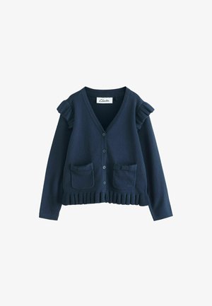 Marineblå cardigan med knapper, flæsedetaljer på skuldrene, to forlommer med sløjfer og ribkant forneden.