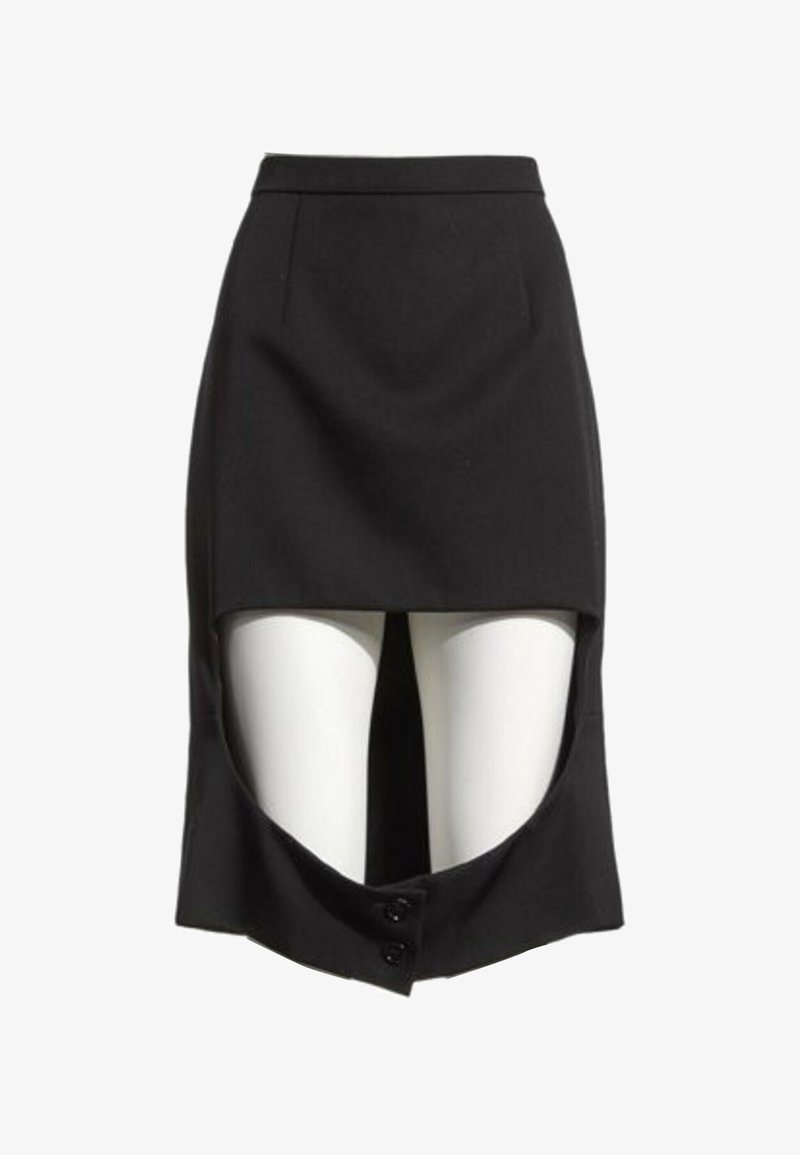 Jupe noire à effet devant court et dos plus long avec une découpe à l'avant révélant un legging blanc, équipée de deux boutons en bas au centre.