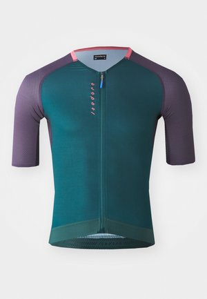 Maillot de cyclisme à manches courtes en teal avec des épaules violettes, comprenant une fermeture éclair quart de tour, un tissu texturé et un logo rose à l'avant.