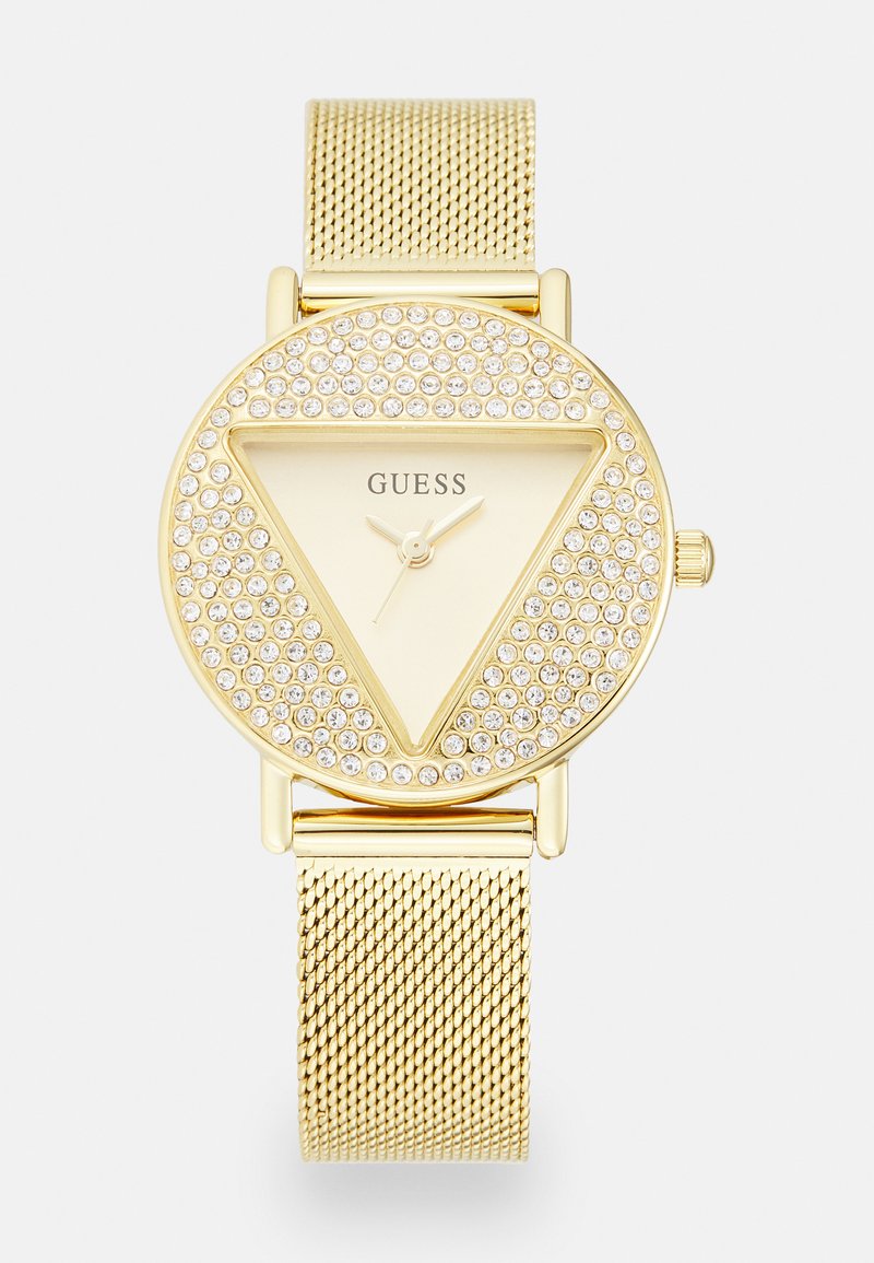 Gold-tone watch featuring a triangular face surrounded by sparkling stones, a minimalist dial, and textured mesh strap.