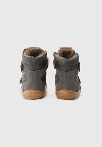 Grey suede ankle boots with a soft fur lining, textile accents, and hook-and-loop straps. Features a light brown rubber sole.