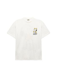 T-shirt en coton blanc présentant un dessin de Snoopy en bande dessinée avec des accents jaunes. Coupe décontractée avec des manches courtes et un col rond. Détail graphique distinctif.