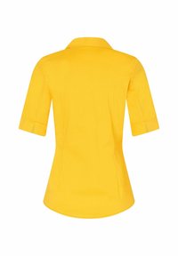 Geel shirt met korte mouwen, voorzien van een puntige kraag, een gladde textuur, een getailleerde vorm en subtiele zijsplitten aan de onderkant.