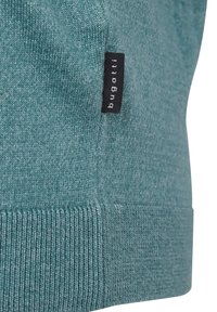 Teal knitted sweater with ribbed hem, featuring a small black label with white text reading "bugatti." Soft texture with subtle color variation.