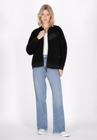 Schmuddelwedda Forro polar - schwarz