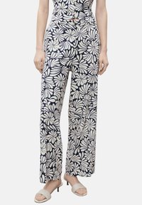 Floral-patterned, wide-leg pants in navy and cream. Made of lightweight fabric with a smooth texture and a relaxed fit.