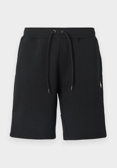 Melnas kokvilnas šorti ar elastīgu jostu, aukliņu un metāla galiem. Ar sānu kabatām un nelielu logotipu apakšējā kājā.