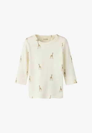 Cremefarbenes Baby-Langarmshirt mit kleinen braunen Giraffenmotiven und rundem Ausschnitt, hergestellt von Lil' Atelier.