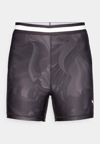 Black swim shorts made of smooth fabric, featuring a subtle pattern, a fitted design, and a contrasting white elastic waistband.