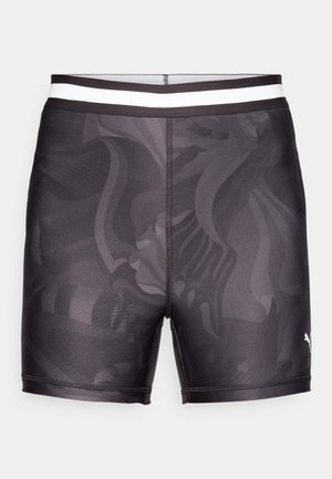 Svarte svømmeshorts laget av glatt stoff, med et subtilt mønster, en tettsittende design, og en kontrasterende hvit elastisk midje.