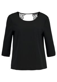 Haut noir à manches trois-quarts avec un col rond et des détails en dentelle au dos. Tissu lisse avec une silhouette classique.