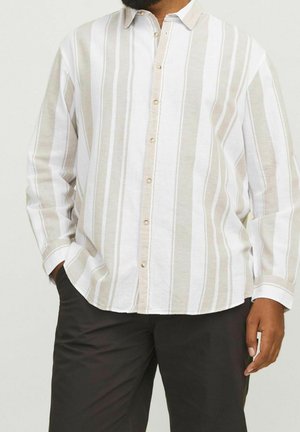 Koszula z długim rękawem w białe i beżowe pionowe paski. Luźny krój, lekki materiał i beżowe guziki.