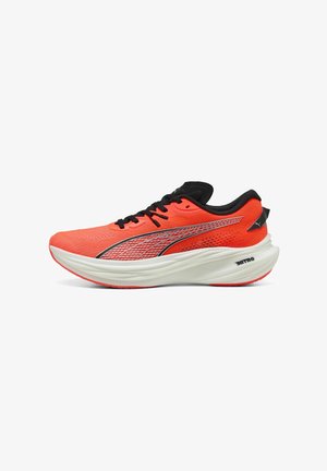 Bright red running shoe with mesh upper, black accents, and silver detailing, featuring a thick white sole with textured tread.