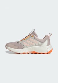 Lightweight sneaker in shades of gray and pastel pink, featuring a textured upper, padded collar, and orange rubber sole for grip.