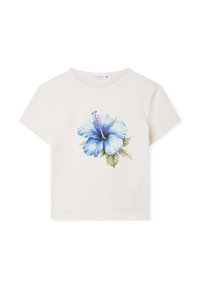 T-shirt in cotone color crema con una grande stampa di fiore ibisco blu sul davanti. Maniche corte, collo a giro e vestibilità rilassata.