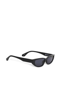 Black cat-eye sunglasses with dark lenses, thick arms, and CE and UKCA certification marks on the inside of the right arm.