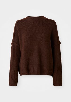 Brunstrikket genser med rund hals, ribbet kant og vide ermer. Myk tekstur og avslappet passform.