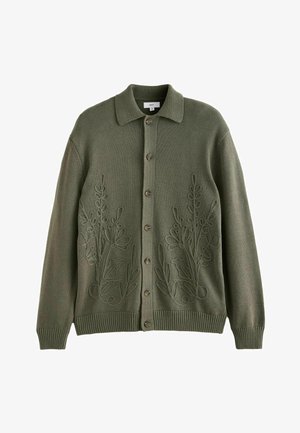 Olivově zelený pletený kardigan s knoflíkovou přední částí, který má květinovou výšivku po obou stranách a ribbed manžety a lem.