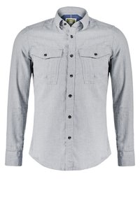 Chemise gris clair à manches longues avec deux poches poitrine boutonnées et un col.