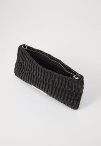 Black woven clutch bag with a textured surface; features a zip closure and interior card slots, made of smooth faux leather.