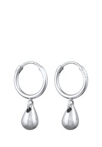Boucles d'oreilles en argent avec un pendentif en forme de goutte lisse, présentant une finition polie et un design minimaliste.