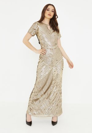 Langes goldenes kleid - Betrachten Sie dem Gewinner der Experten