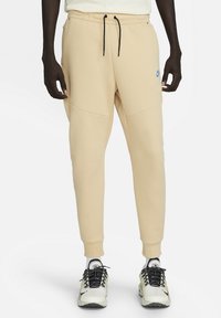 Nike Sportswear Träningsbyxor - beige