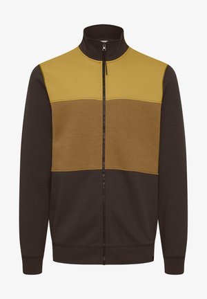 Giacca con zip caratterizzata da un colletto alto, design colorato con pannelli gialli e marroni e polsini e orlo a coste. Tessuto morbido.