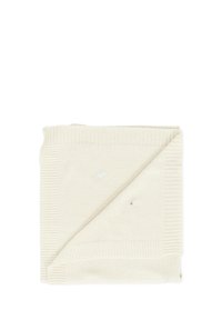 Coperta lavorata a maglia di colore crema, piegata con un bordo a coste. Presenta modelli ricamati sottili in blu e grigio. Texture morbida.