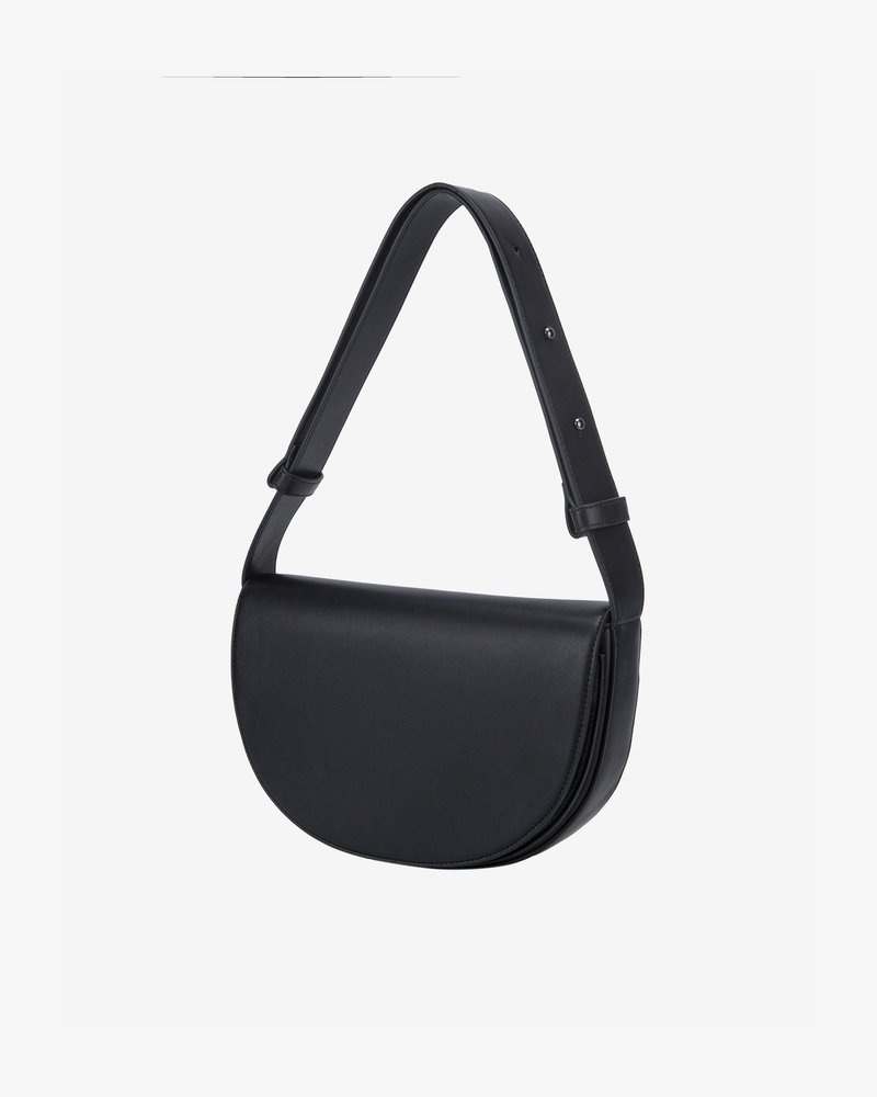 Black leather shoulder bag with a curved shape, adjustable strap, and sleek design. Features a fold-over flap and minimal stitching details.