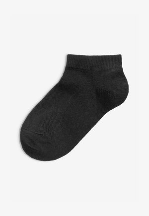 Schwarze Knöchelsocke aus weichem, gestricktem Stoff. Sie hat einen gerippten Bund, eine glatte Textur und eine abgerundete Zehe. Keine Muster oder Verzierungen.