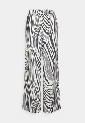 Pantalons larges en tissu léger, avec un imprimé abstrait noir et blanc de zèbre et une taille élastique.