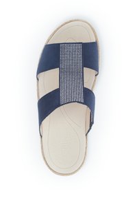 Navy blue sandal with cross straps made of soft suede and a woven band. Features a textured, cushioned insole and a cork outsole.