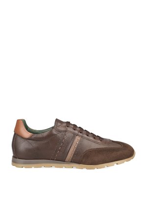 Low-profile brown leather sneaker with suede toe, tan heel patch, lace-up closure, and light beige rubber sole, shown from the outer side.