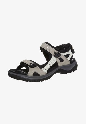 Graue und schwarze Sandale mit verstellbaren Riemen, aus Wildleder und Netzmaterial, mit Belüftungsöffnungen für Atmungsaktivität, Gummisohle für Rutschfestigkeit.