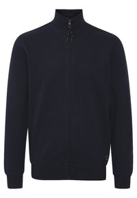 Námorná mikina na zips s vysokým golierom, rebrovanými manžetami a lemom. Hladká textúra s minimalistickým dizajnom a bez viditeľných vzorov alebo ozdôb.