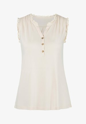 Light beige sleeveless top with ruffled neckline, three button placket, soft fabric, and A-line silhouette. Smooth texture, casual design.