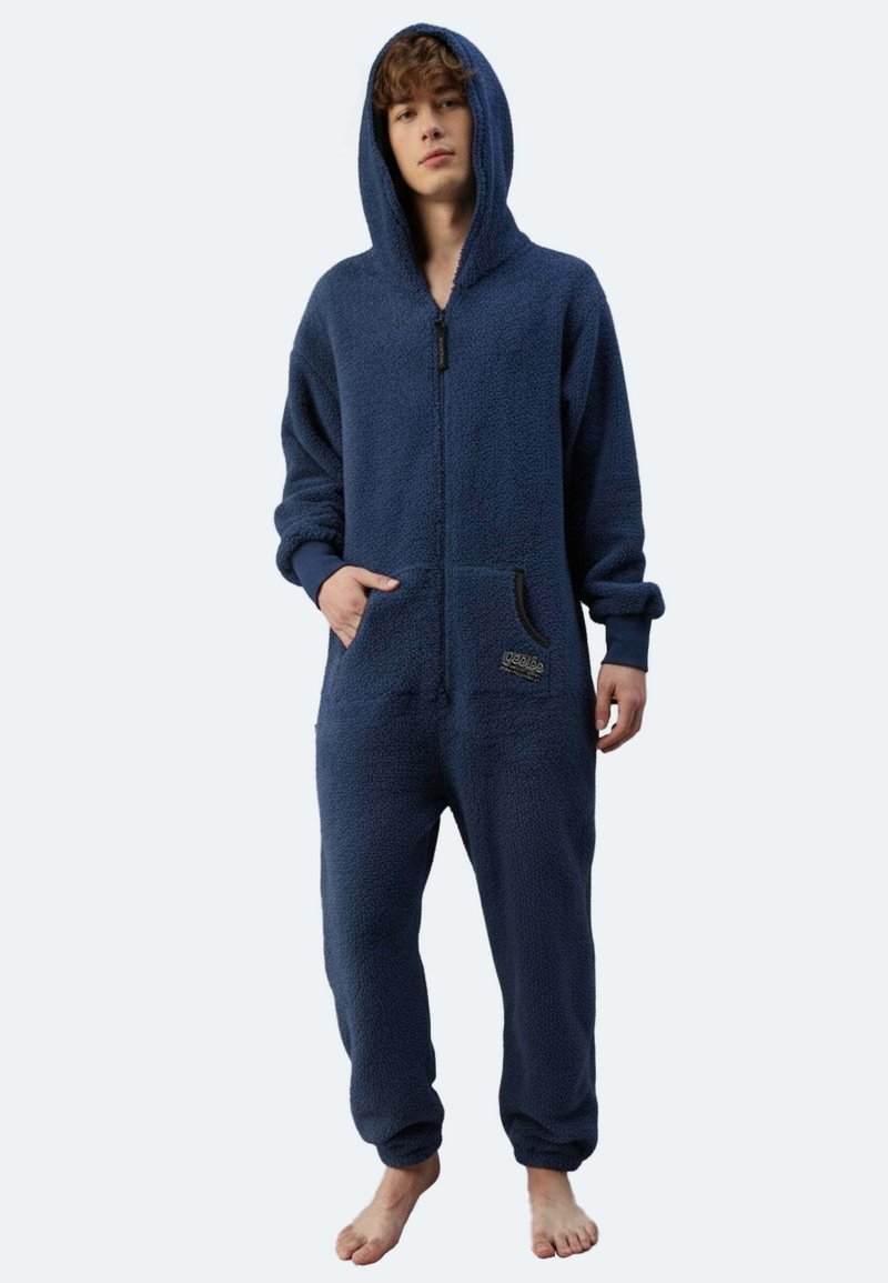 Marineblauer Fleece-Einteiler mit Kapuze, Reißverschluss, langen Ärmeln und Taschen. Hat eine weiche Textur und elastische Bündchen an den Knöcheln.