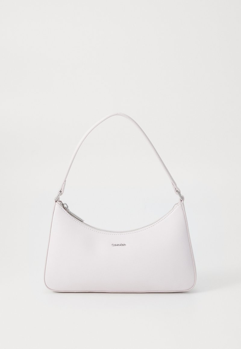 Pink leather shoulder bag with a curved design, zipper closure, and silver hardware accents. Minimalist logo on the front.