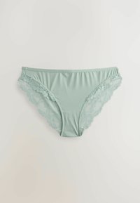 Jasnozielone majtki w stylu bikini, wykonane z gładkiego, elastycznego materiału, z falbaniastymi koronkowymi akcentami po bokach. Płaski pas z niewidocznymi szwami.
