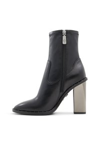 Black leather ankle boots with a pointed toe, side zipper, and a metallic block heel. Features stitched detailing along the edges.