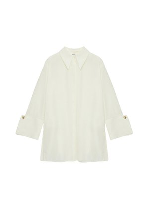 Light cream collared shirt with long sleeves, featuring buttoned cuffs. Constructed from a smooth fabric with a relaxed fit.