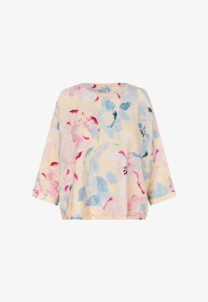 Oberteil mit Blumenmuster in sanftem Gelb, verziert mit blauen und pinken Blüten. Lockerer Schnitt mit Dreiviertelärmeln und rundem Ausschnitt, leichter Stoff.