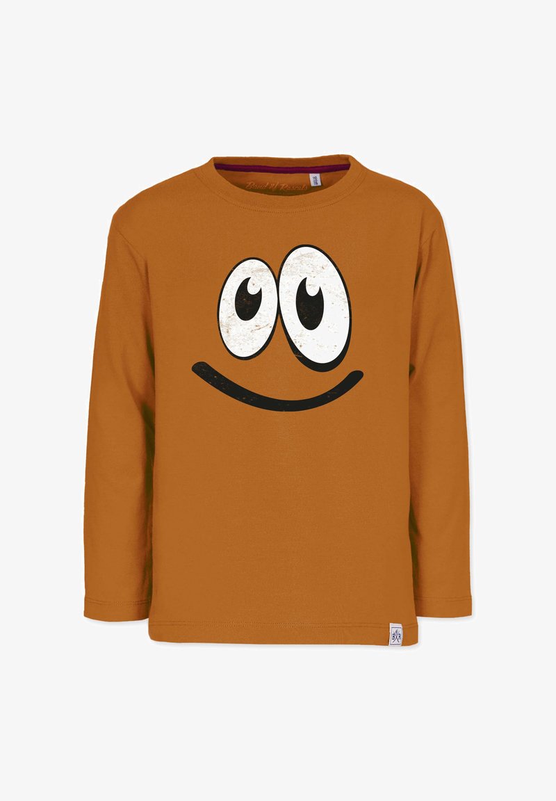 Langærmet, orange bomulds-T-shirt med et stort, slidt sort smiley-ansigt med fremtrædende hvide øjne.