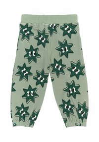 Pantaloni verzi din bumbac prezintă un model cu stele și ochi, talie elastică și manșete înguste.