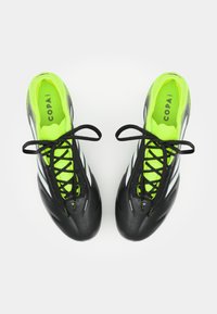 Black soccer cleats with a smooth texture, bright green laces and insoles, and white accent stripes. Features a streamlined design for performance.